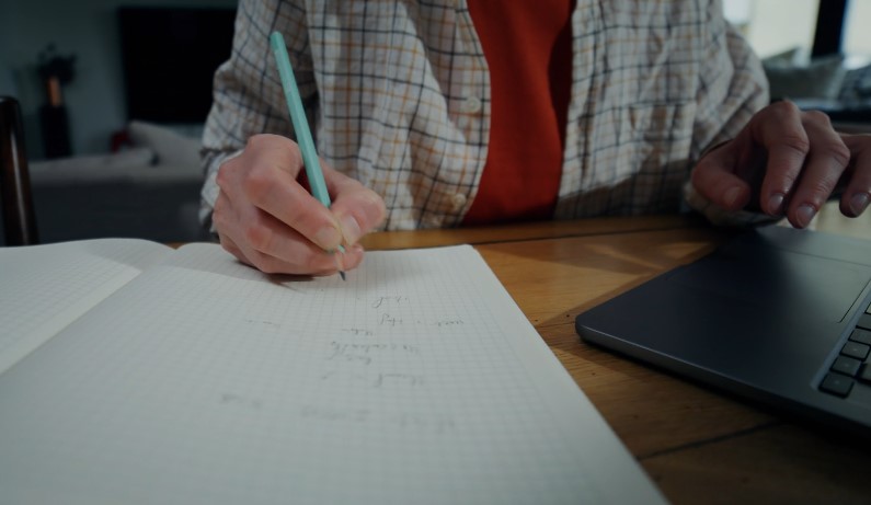A person works through calculations