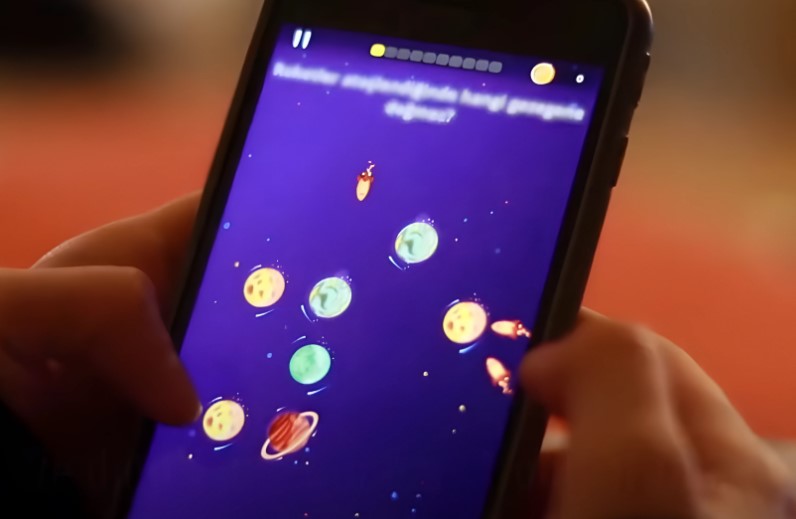 A mobile game, featuring planets and space-faring objects