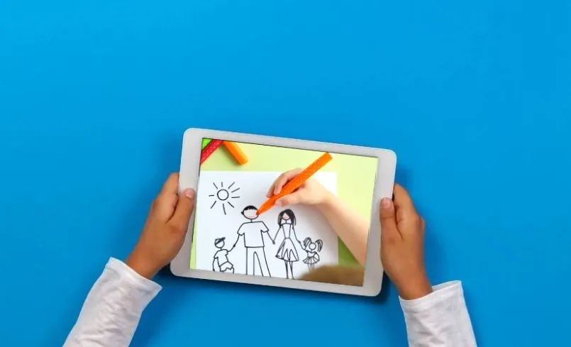 Child's hands hold a tablet, digitally drawing a family portrait