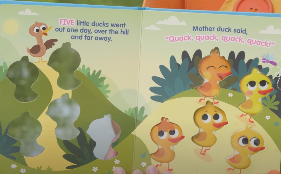 A children's book spread featuring five little ducks on a whimsical journey
