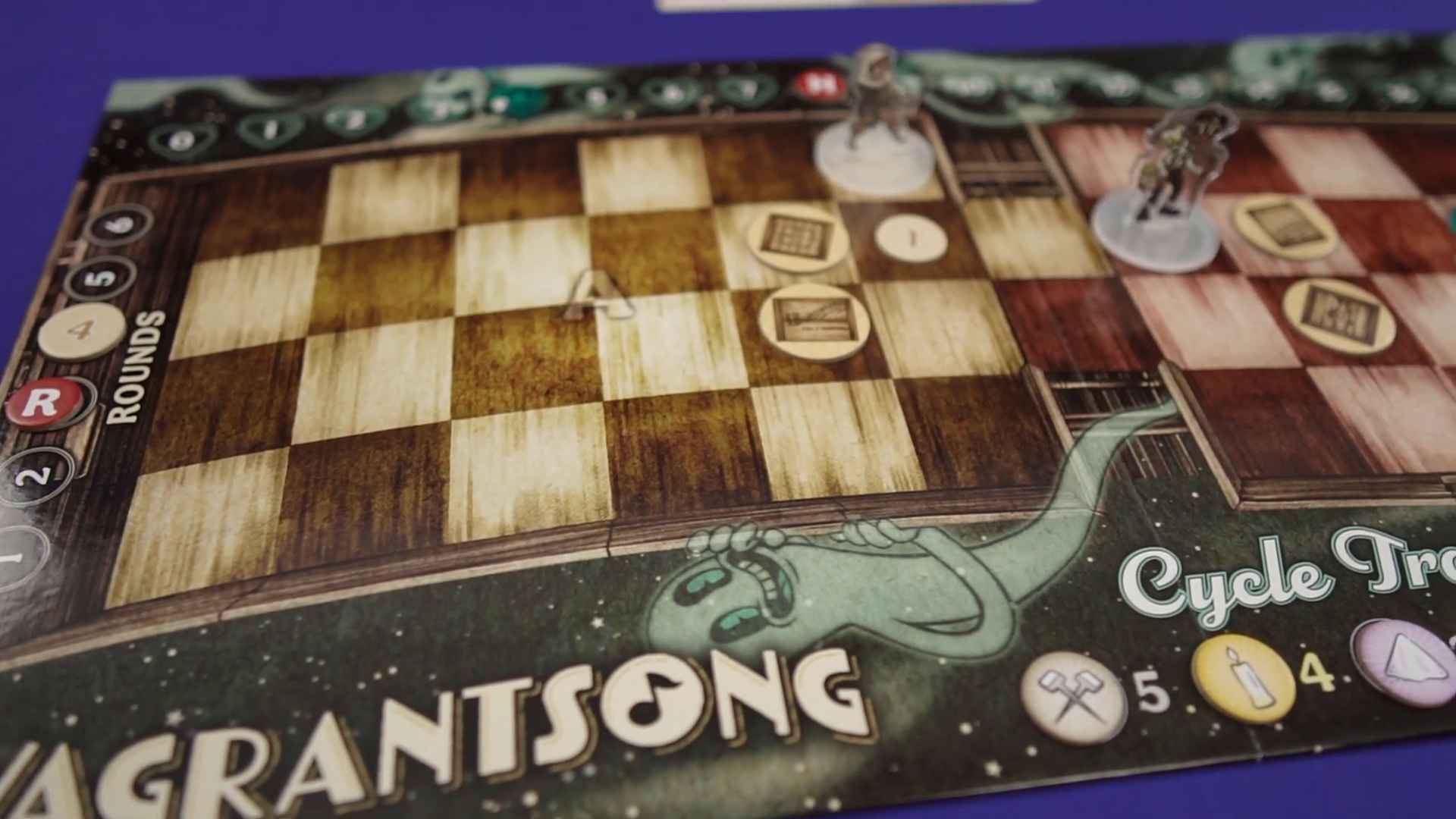 Close-up of the Vagrantsong board game showing a checkerboard layout, tokens, and ghostly artwork