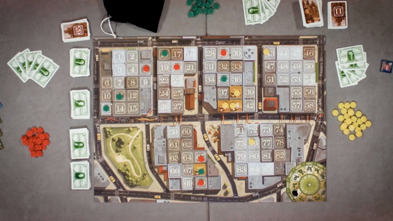 Overhead view of the Chinatown board game setup