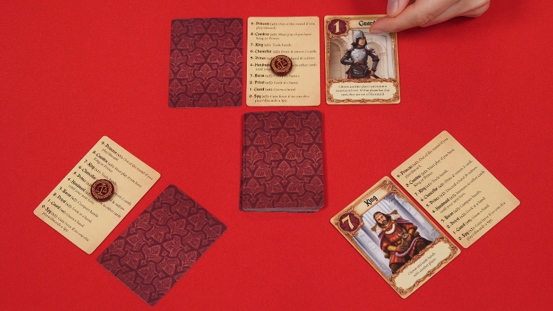 A round of Love Letter in progress shows character cards, tokens, and the draw pile on a red table