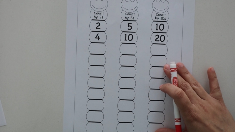 A hands-on skip counting worksheet for beginners showing number patterns by 2s, 5s, and 10s using fun caterpillar shapes