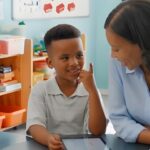 Teacher and student doing homework together on a tablet