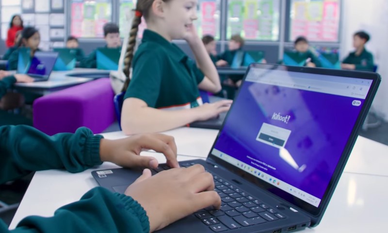 Young student using Kahoot app on a laptop during a class